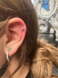 a girl with a piercing on her ear