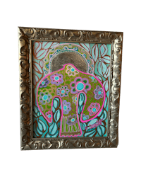 a framed painting of an elephant in a colorful frame