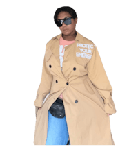 a woman wearing a trench coat and sunglasses