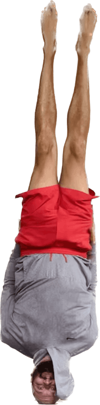 a man in a red hoodie doing a handstand
