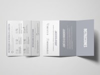 a tri fold brochure with white text on a gray background
