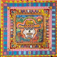 a colorful painting of a day of the dead skull