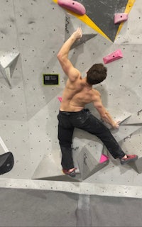 a man climbing on a climbing wall