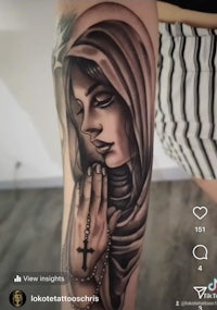 a tattoo of a woman with a rosary on her arm