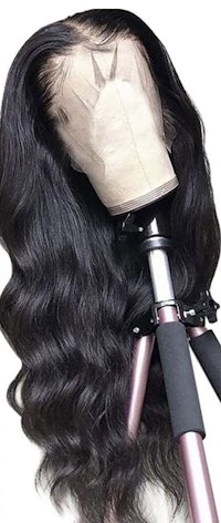 brazilian wavy lace front wig on a tripod