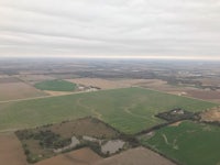 an aerial view of a farm and fields