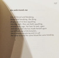 an open book with a poem on it