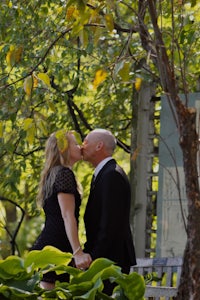 a couple kissing in a park
