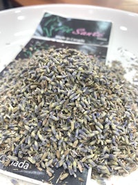 a pile of dried lavender on a white plate