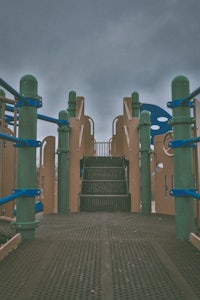 an image of a children's playground under a cloudy sky
