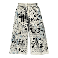 a pair of denim pants with designs on them