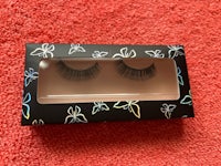 a pair of false eyelashes in a black box