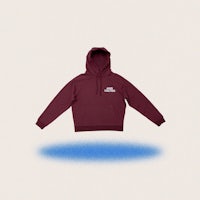 a maroon hoodie with a blue background