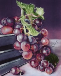 a painting of grapes on a book