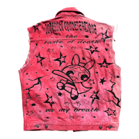 a denim vest with an image of a bunny and stars on it