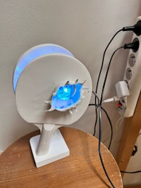 a lamp with a blue light attached to it