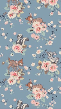 a disney fabric with deer and flowers on it