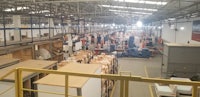 the inside of a warehouse with lots of boxes