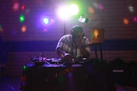 a dj is playing music at a party