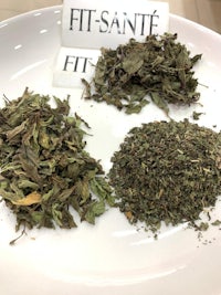 two different types of herbs on a plate