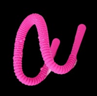 a pink coiled sex toy on a black background