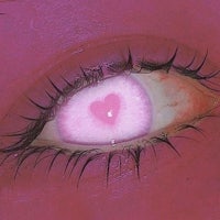 a pink eye with a pink heart in it