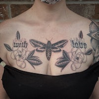 a woman with a moth tattoo on her chest