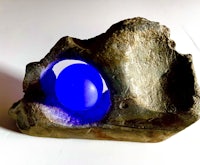 a rock with a blue ball inside of it