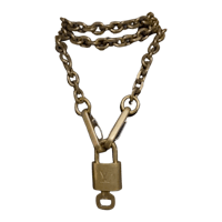 a gold chain with a padlock on it
