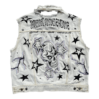 a denim vest with stars and skulls on it