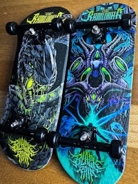 two skateboards with different designs on them