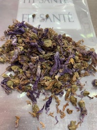 a bag of dried purple flowers on a table