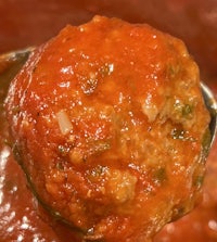 meatballs in sauce on a spoon