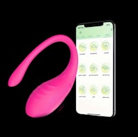 a pink sex toy next to a cell phone