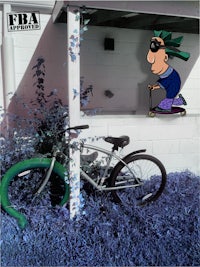 a bicycle leaning against a wall