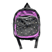 a purple backpack with black and purple rhinestones on it