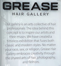 a sign that says grease hair gallery