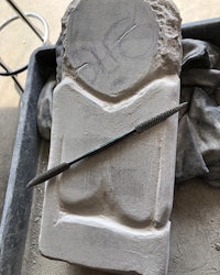 a piece of stone with a chisel in it