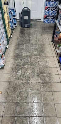 a tile floor in a store with a lot of products on it