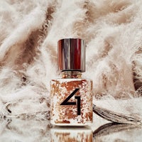 a bottle of perfume with the number 4 on it