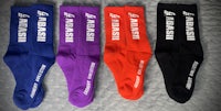 four pairs of socks with the word kabashi on them