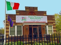 a building with an italian flag outside