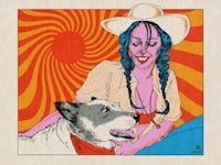 a woman in a cowboy hat with a dog on her lap