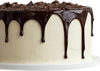 a chocolate cake with chocolate dripping on top