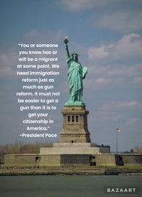 a statue of liberty with a quote on it