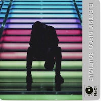 a silhouette of a man sitting on a set of colorful stairs