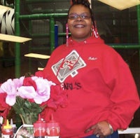 a woman wearing a red hoodie