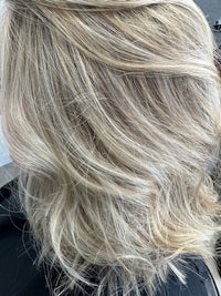 a woman with blonde hair in a salon