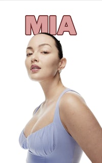 a woman in a blue dress with the word mia on it