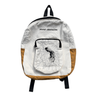 a backpack with a black and white drawing on it